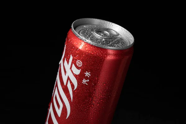 red beer can on black background