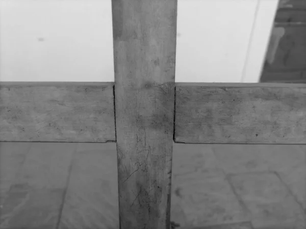 old wooden cross on the background of the church