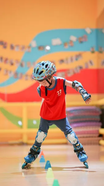 young boy playing basketball on the stadium