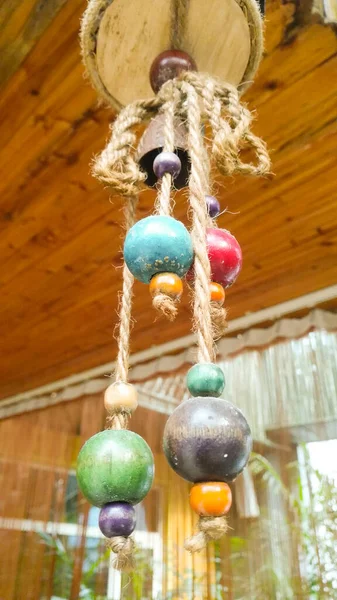 handmade decorative beads hanging on a tree