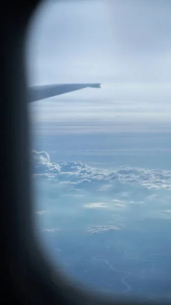 aerial view of the airplane window, sky and clouds