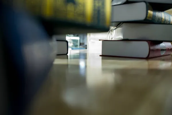 close up of a book with a stack of books