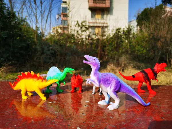 toy dinosaur on the street