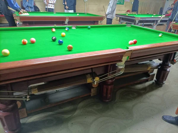 pool table with cue and balls