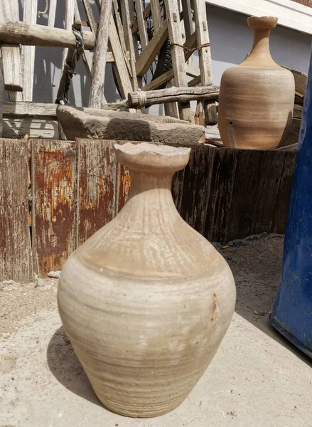 clay pot with a jug of water