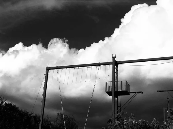 black and white photo of a man in the sky