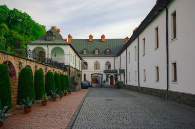 central Europe architecture building complex of orthodox monastery campus yard with medieval street pavement cobblestone object