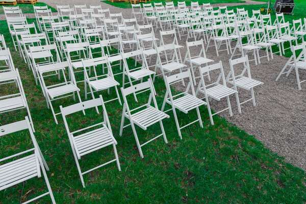 chairs rows of some outdoor garden event like birthday party or wedding