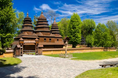 Ukraine country side old orthodox wooden church for praying and pilgrimage god service, religion architecture building object near the forest in vibrant summer weather
