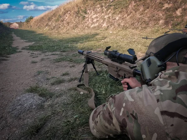 Ukrainian army sniper soldier training at shooting range space