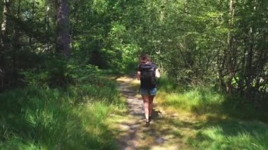 caucasian woman hiking in forest
