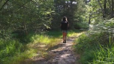 caucasian woman hiking in forest