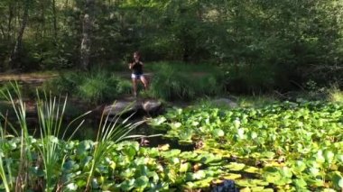 caucasian woman hiking in forest