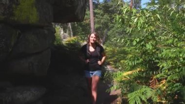 caucasian woman hiking in forest