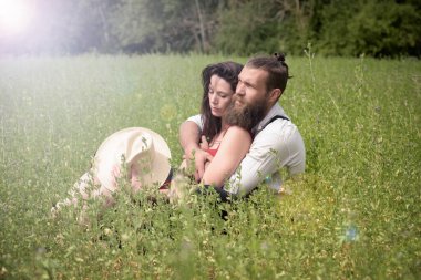 beautiful caucasian couple in love in a meadow in France