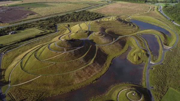Drone view of the lady of the north, a huge land sculpture in the shape of a reclining female figure, near Cramlington, Northumberland, northern England. Made of 1.5 million tonnes of earth.