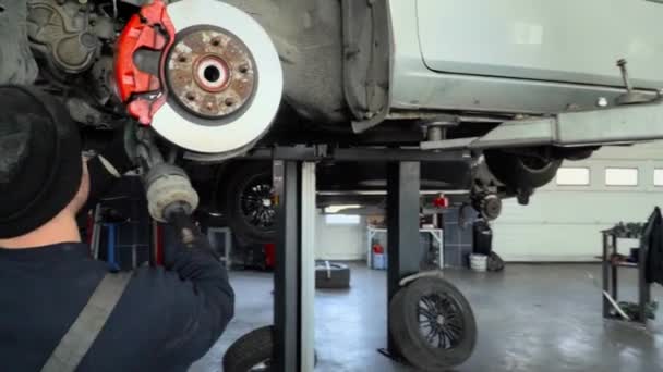 Three Mechanics Repair Suspension Car — Stockvideo