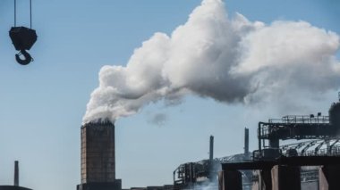 Smoke from a pipe factory polluting air, environmental problems. Cinemagraph.