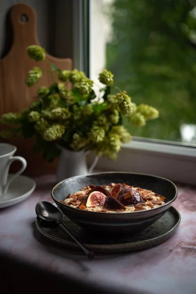 Oatmeal for breakfast with figs and agave syrup