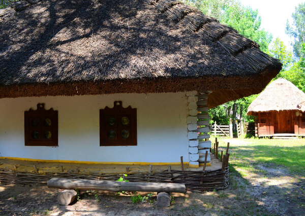 Village house, white thatched house in the village in summer, village houses architecture