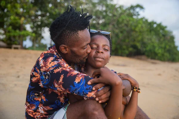 Boy Sitting Beach Sand Clinging Girl Kisses Her Cheek — Fotografia de Stock