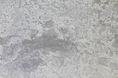 Kenarlarında gri aksanlı gri-beyaz bir arka plan. Dekoratif alçı dokusu