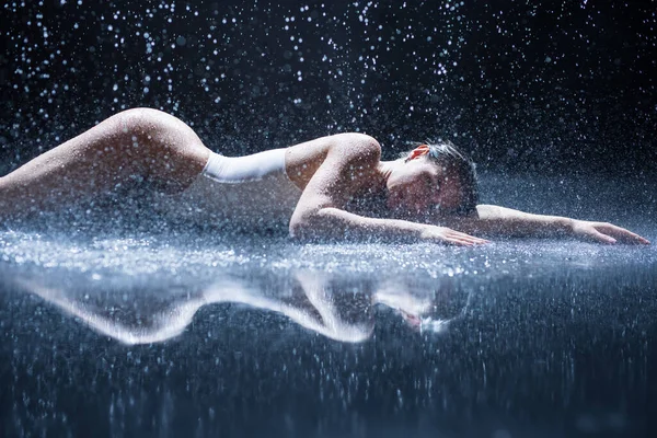 Sexy woman lying in aqua studio — Stock Photo, Image