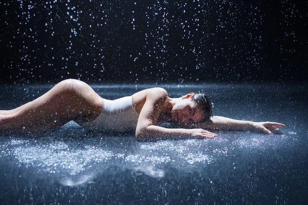 Sexy woman lying in aqua studio — Stock Photo, Image