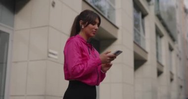 Sporty woman jogger choose music in smartphone for jogging