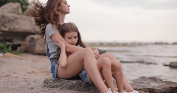 Two Cute Sisters Sitting Beach Sea Relaxing Together — Vídeos de Stock