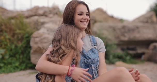 Two Cute Sisters Talks Together Beach Sea — Stockvideo