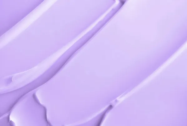 Décryptages crème crème violet clair crème hydratant frottis tache texture ondulée. Produit de beauté pour la peau. Shampooing ou après-shampooing tache — Photo