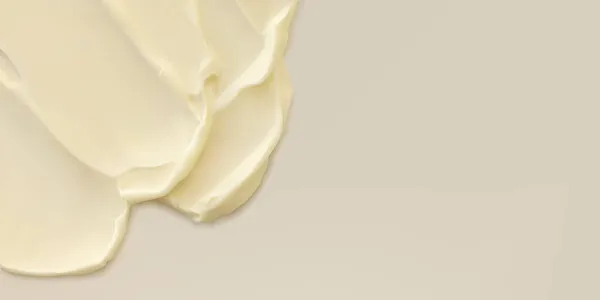 Close-up creme amarelo hidratante mancha mancha textura ondulada no fundo bege. Cuidados com a pele beleza produto ilustração vetorial realista — Vetor de Stock
