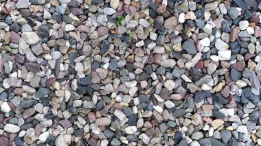 Çakıl taşlarının arka planı. İnce çakıl dokusu.