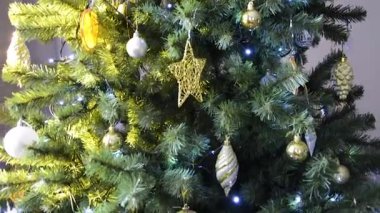 The garland is flashing on the tree. Christmas, winter, New Year.