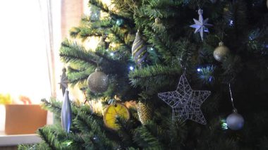 The Christmas tree is decorated with toys and lanterns. Christmas, winter, New Year.