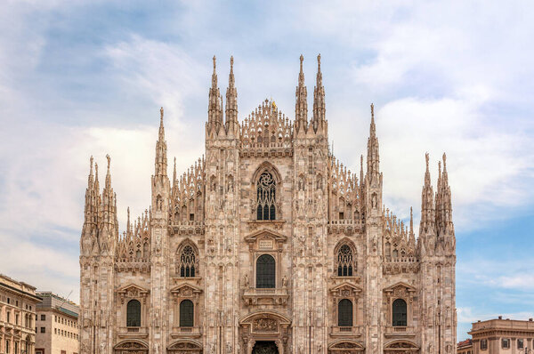 Metropolitan city of Milan, Italy, 27 June, 2019, architecture details of Duomo Di Milano - one of the largest cathedrals in the world. View of front facade of the Cathedral.
