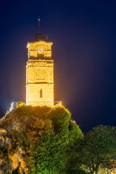 Central clock at Arachova in Greece during night.