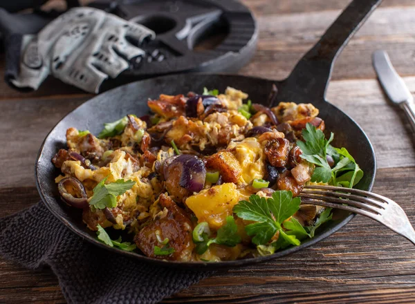 Body building meal for muscle or mass gain with roasted potatoes, low fat ham, red onions, scrambled eggs and scallions.Vegetarian and gluten free