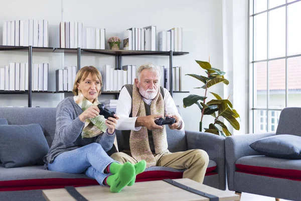 Senior Couple Enjoy Playing Competing Online Game Home Sofa Couch —  Fotos de Stock