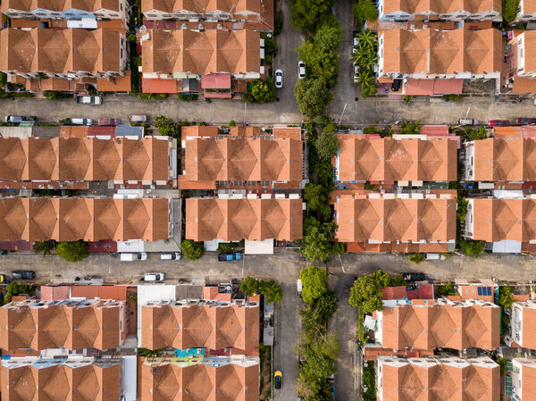 Aerial drone shot of suburb area surrounded by high density village in overpopulation city for housing and real estate property
