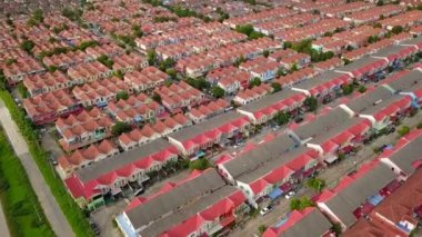 Aerial drone shot of suburb area surrounded by high density village in overpopulation city for housing and real estate property
