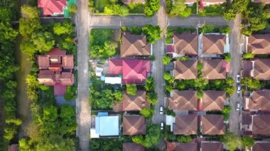 Aerial drone shot of suburb area surrounded by green eco-friendly environment for housing and real estate project top view
