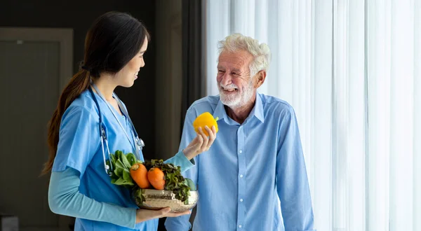 Hospice Nurse Nutritionist Suggesting Variety Vegetable Caucasian Man Pension Retirement — Stok fotoğraf