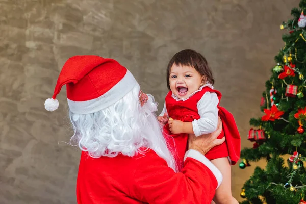 Santa Claus Lifting Happy Little Toddler Baby Girl Laughing Cheerfully — Φωτογραφία Αρχείου