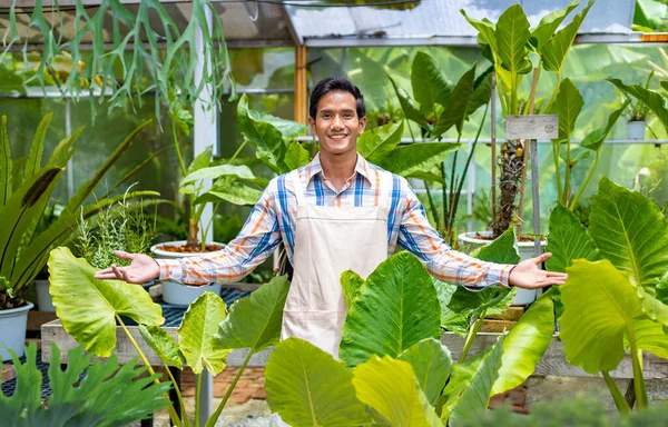 Asian Gardener Welcoming Customers While Working Greenhouse Rainforest Exotic Plant — Stock Photo, Image