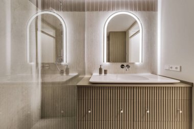 Modern minimalist banyo iç tasarımı mermer taş fayanslar ve haki rengi mobilyalar.