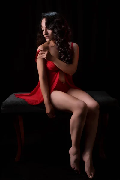 Beautiful Latina Woman Red Lingerie Sitting Bench Black Background Low — Foto de Stock