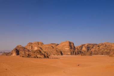 Wadi Rum Desert landscape in Jordan. Dunes and mountains. Travel and tourism concept.