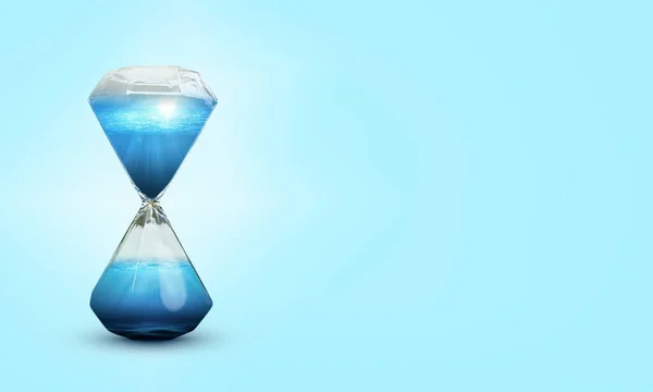 Reloj Arena Con Agua Sobre Fondo Azul —  Fotos de Stock